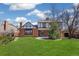Spacious backyard with lush lawn, mature trees, and patio area at 12807 Garfield Cir, Thornton, CO 80241