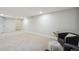 Spacious finished basement with neutral carpet and a cozy seating area with recessed lighting at 12807 Garfield Cir, Thornton, CO 80241