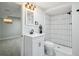 Nicely remodeled bathroom with a black faucet, tile shower and marble floors at 12807 Garfield Cir, Thornton, CO 80241