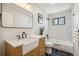 Bathroom with a farmhouse sink, marble countertop, and modern fixtures at 12807 Garfield Cir, Thornton, CO 80241