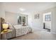 Light and airy bedroom with a decorative bed, carpet, and ensuite bathroom at 12807 Garfield Cir, Thornton, CO 80241