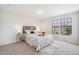 Bright bedroom with a decorative bed, neutral walls, and two windows with a view at 12807 Garfield Cir, Thornton, CO 80241