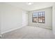 Neutral bedroom featuring plush carpeting and two windows with natural light at 12807 Garfield Cir, Thornton, CO 80241