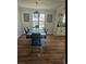 Dining room with contemporary table, chairs, and stylish light fixture at 12807 Garfield Cir, Thornton, CO 80241