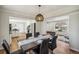 Elegant dining room with stylish lighting fixture and views to the kitchen and living room at 12807 Garfield Cir, Thornton, CO 80241