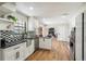 Well-designed kitchen with white cabinetry, black countertops, and modern finishes at 12807 Garfield Cir, Thornton, CO 80241