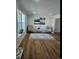 Cozy living room features wood floors, neutral walls, and comfortable seating at 12807 Garfield Cir, Thornton, CO 80241