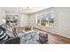 Cozy living room filled with natural light and decorated with a modern rug at 12807 Garfield Cir, Thornton, CO 80241