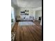 Cozy living room features wood floors, neutral walls, and comfortable seating at 12807 Garfield Cir, Thornton, CO 80241