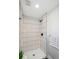 Modern walk-in shower with white subway tile and sleek matte black shower fixtures at 12807 Garfield Cir, Thornton, CO 80241