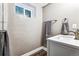 Basement bathroom with a shower and vanity at 3792 E Briarwood Ave, Centennial, CO 80122