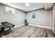 Finished basement room with a window and wood flooring at 3792 E Briarwood Ave, Centennial, CO 80122