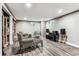 Finished basement with gray laminate flooring at 3792 E Briarwood Ave, Centennial, CO 80122