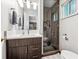 Modern bathroom with a glass shower, updated vanity, and stylish tile at 3792 E Briarwood Ave, Centennial, CO 80122