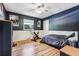 Cozy bedroom with hardwood floors and a built-in dresser at 3792 E Briarwood Ave, Centennial, CO 80122