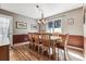 Bright dining room featuring a wood table and chairs, hardwood floors, and a chandelier at 3792 E Briarwood Ave, Centennial, CO 80122