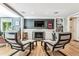 Gathering room featuring a fireplace and built-in shelving at 3792 E Briarwood Ave, Centennial, CO 80122