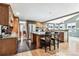 Spacious kitchen with granite countertops and wood cabinetry at 3792 E Briarwood Ave, Centennial, CO 80122