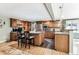 Spacious kitchen with granite countertops and wood cabinetry at 3792 E Briarwood Ave, Centennial, CO 80122