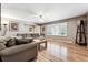 Living room with hardwood floors, sectional sofa and large windows at 3792 E Briarwood Ave, Centennial, CO 80122