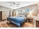 Main bedroom with hardwood floors, a king-size bed, and built-in wardrobe at 3792 E Briarwood Ave, Centennial, CO 80122