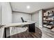 Basement office with large desk and storage at 3792 E Briarwood Ave, Centennial, CO 80122