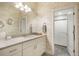 Bathroom featuring a wide vanity with ample storage and a walk-in shower with glass doors at 16486 Florawood Pl, Monument, CO 80132