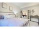 Bedroom featuring soft decor, plush pillows, and a view into the game room at 16486 Florawood Pl, Monument, CO 80132