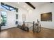 Inviting entryway with a hardwood floor, a large window, and stylish decor at 16486 Florawood Pl, Monument, CO 80132