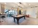 Large game room with pool table, sliding door to a patio and neutral decor at 16486 Florawood Pl, Monument, CO 80132
