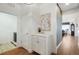 Entry hallway leads to a laundry room and formal dining room at 16486 Florawood Pl, Monument, CO 80132