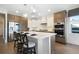 Gourmet kitchen features stainless appliances, stone countertops, and island with seating at 16486 Florawood Pl, Monument, CO 80132