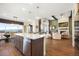 Open-concept kitchen features stainless appliances, island, stone countertops, and great views of the outdoors at 16486 Florawood Pl, Monument, CO 80132