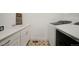 Laundry room has modern appliances and custom cabinets at 16486 Florawood Pl, Monument, CO 80132