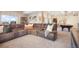 Spacious living room featuring a sectional sofa, a large window, and a pool table at 16486 Florawood Pl, Monument, CO 80132
