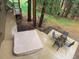 Elevated view of the backyard with a covered hot tub, table with chairs and wooded view at 1332 Meadow Trl, Franktown, CO 80116