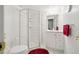 Bathroom featuring a glass enclosed walk-in shower, white vanity, red accents, and tile flooring at 1332 Meadow Trl, Franktown, CO 80116