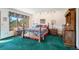 Serene bedroom boasts a wooden bed frame, decorative bedding, and a large window overlooking the scenic outdoors at 1332 Meadow Trl, Franktown, CO 80116