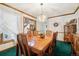 Formal dining room with a crystal chandelier, wood table and chairs, and natural lighting at 1332 Meadow Trl, Franktown, CO 80116