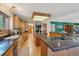 Spacious kitchen featuring oak cabinets and granite countertops, complete with lots of counter space and an island at 1332 Meadow Trl, Franktown, CO 80116