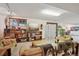 Spacious finished basement living room area features a TV, sofas, shelving, and natural light at 1332 Meadow Trl, Franktown, CO 80116