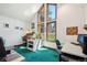 Well-lit office space with large windows, desk space, and a view of the yard at 1332 Meadow Trl, Franktown, CO 80116
