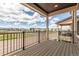 Enjoy the outdoors with mountain views on this home's covered balcony and wrought iron railing at 8953 Southurst St, Littleton, CO 80129