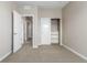 A light and airy bedroom with a closet and doorway at 8953 Southurst St, Littleton, CO 80129