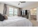 Comfortable primary bedroom with many windows for natural light and a bathroom view at 8953 Southurst St, Littleton, CO 80129
