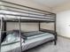 Cozy bedroom featuring a bunk bed with colorful bedding and a view of the closet at 8953 Southurst St, Littleton, CO 80129
