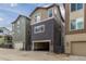 Modern townhome featuring a unique color palette, front-facing garages and private entrance at 8953 Southurst St, Littleton, CO 80129