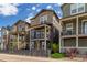 Charming street view of modern homes with covered balconies and well-maintained landscaping at 8953 Southurst St, Littleton, CO 80129