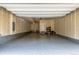 Spacious three car garage with epoxy flooring and ample storage space at 8953 Southurst St, Littleton, CO 80129