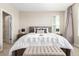 Comfortable main bedroom with soft textures, a wooden headboard and serene ambiance at 8953 Southurst St, Littleton, CO 80129